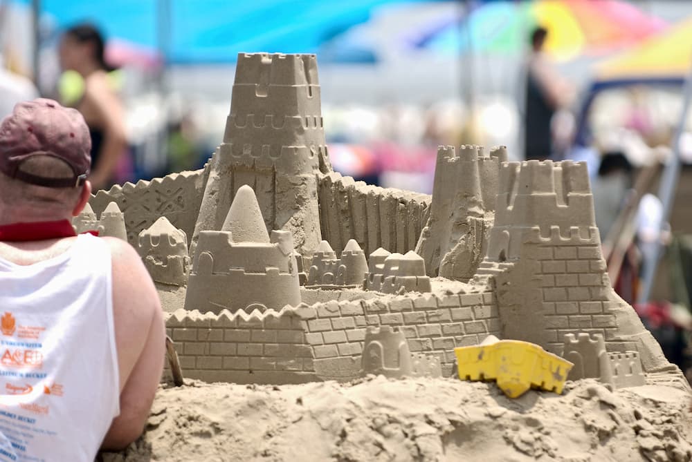 Disabled man building a sand castle