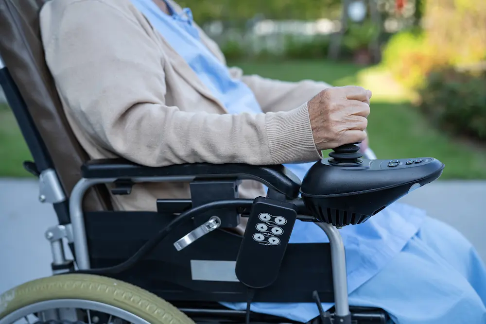 Asian senior or elderly old lady woman patient on electric wheelchair