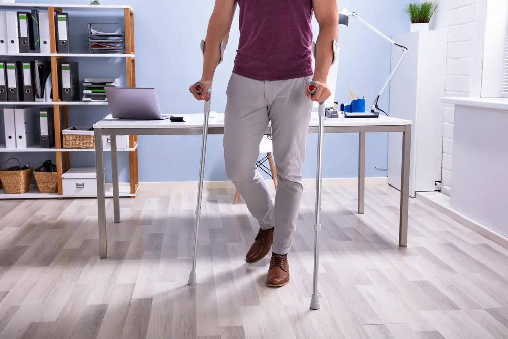 Handicapped Businessman Walking On Hardwood Floor