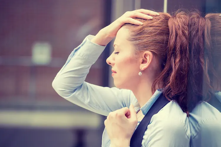Portrait stressed sad young woman outdoors.