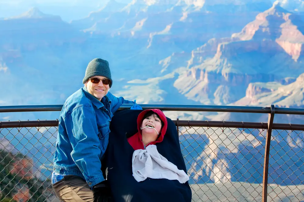 Father with disabled son in wheelchair at Grand Canyon