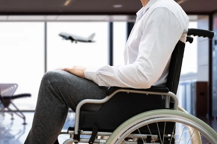Disabled Adult People Travel In Wheelchair At Airport