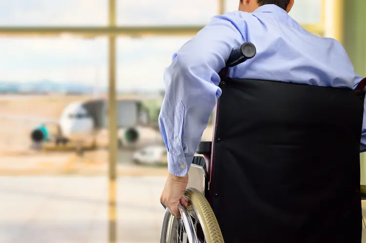 Wheelchair businessman at airport